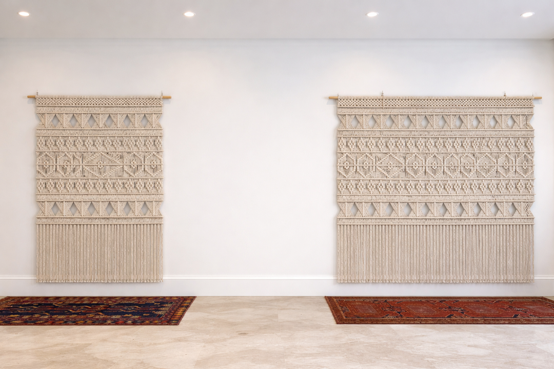 Two woven wall hangings with geometric patterns on a white wall.