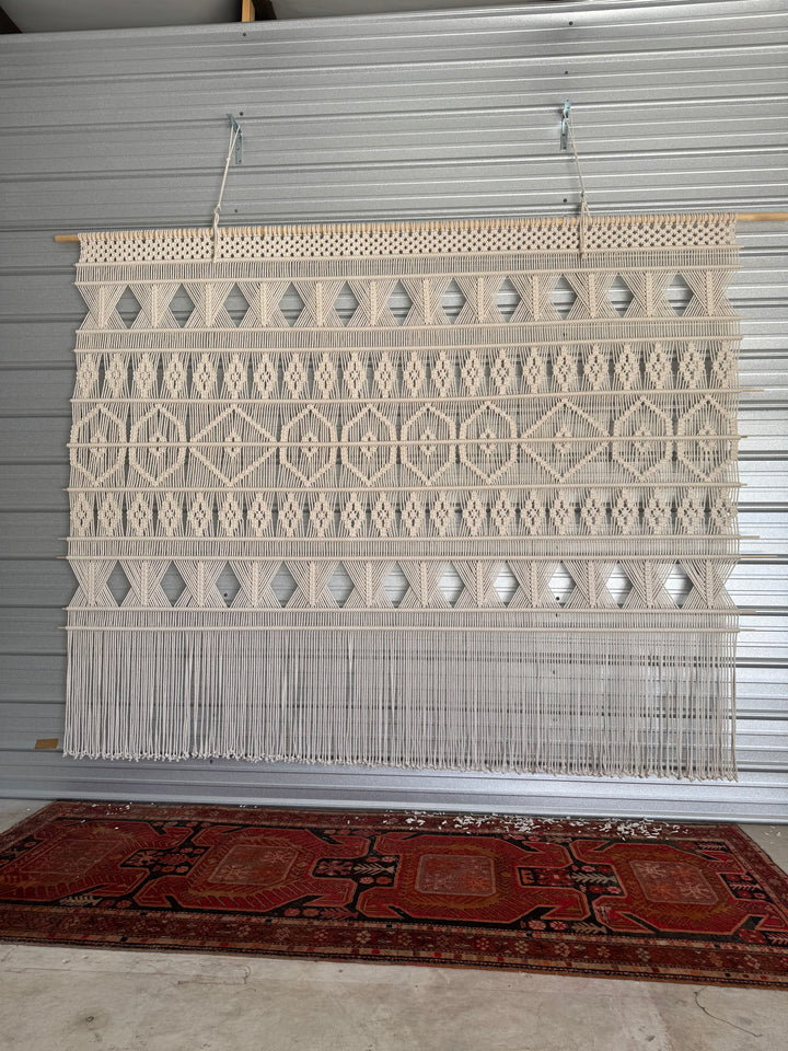 macrame wall hanging inside a hotel.