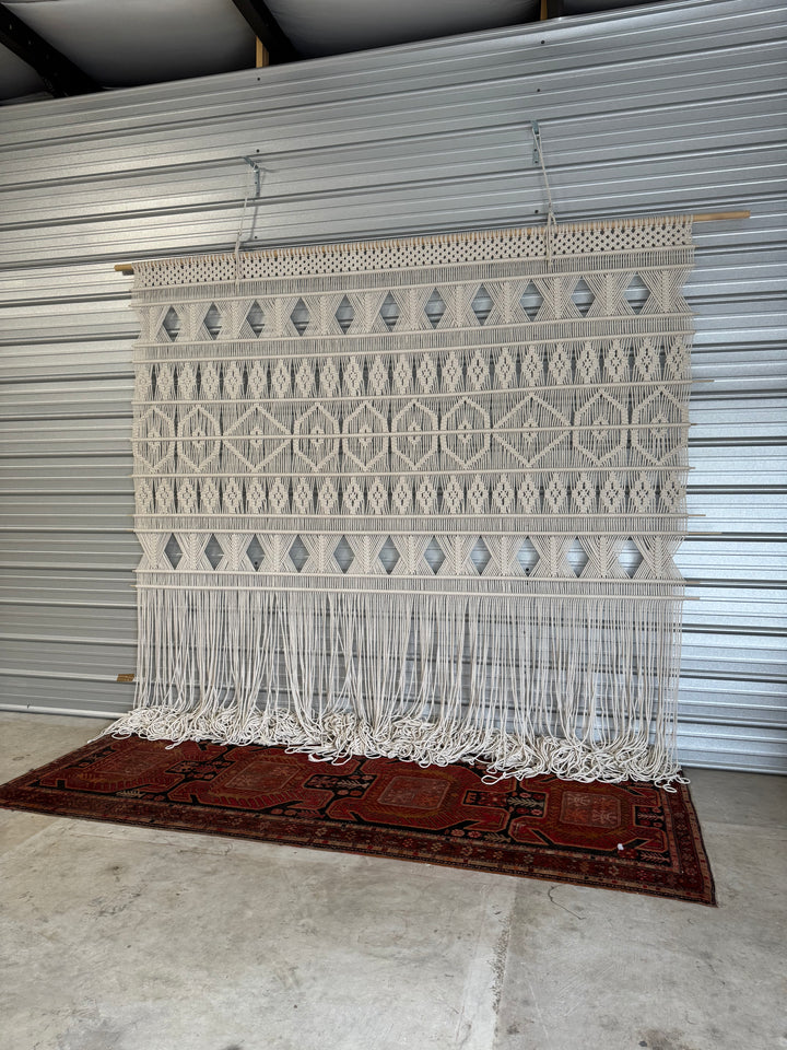Geometric wall hanging inside the studio of MossHound Designs