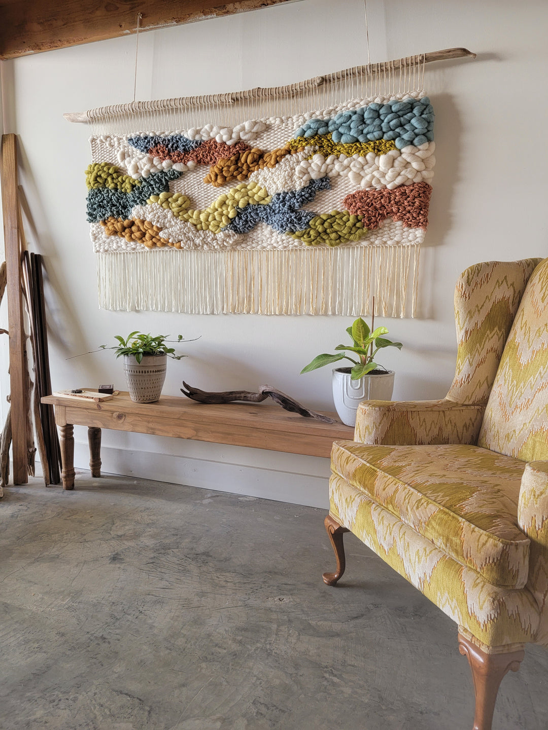 handwoven wall hanging in lobby entryway